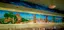 Custom restaurant mural restoration - Mediterranean coastal scene with classical architecture and figures painted on dining room walls with professional conservation