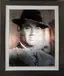 Deteriorating film portrait of man in formal attire with water damage and bubble effects