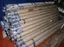 Professional backdrop storage showing rolled scenic backdrops in protective sleeves, demonstrating proper backdrop inventory management and rental preparation