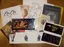 Assorted art exhibition catalogs, brochures, and promotional materials including Russian lacquer boxes and fine art publications, demonstrating diverse print design capabilities for cultural institutions and galleries